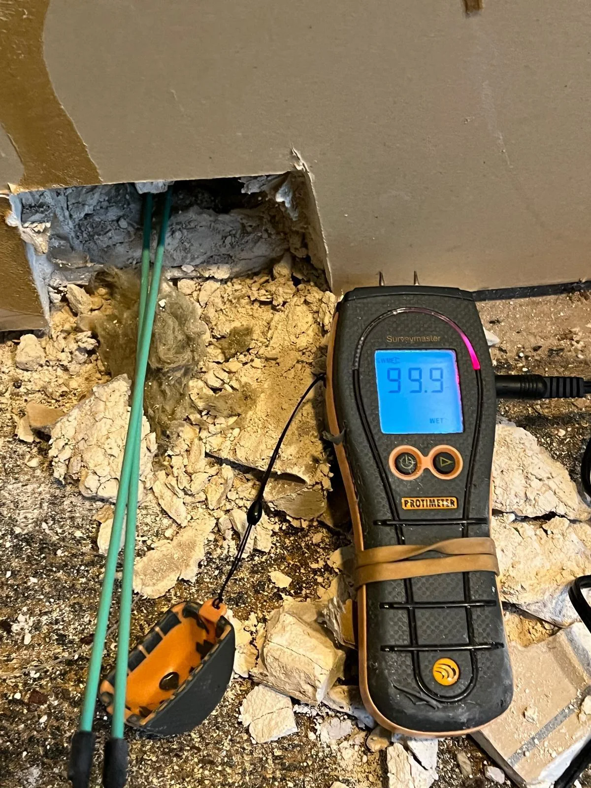Moisture measuring equipment used to inspect an affected area
